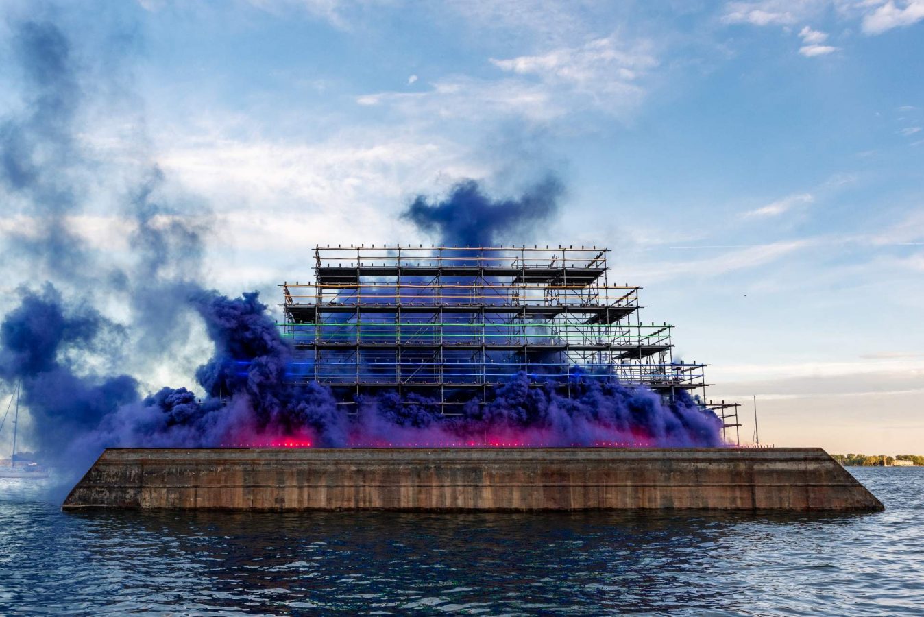 View of installation A Tribute to Toronto (2022) by Judy Chicago in collaboration with Pyro Spectaculars by Souza and Maude Furtado of GFA PYRO. Photo: Rebecca Tisdelle-Macias. Smoke Sculpture™ commissioned by the Toronto Biennial of Art and made possible with the generous support of the City of Toronto, ArtworxTO, the Delaney Family Foundation, Menkes Developments, Waterfront Toronto, the Waterfront BIA, and the Women Leading Initiative.